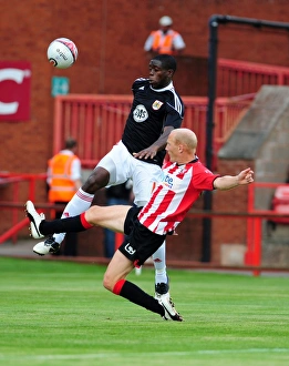 Bristol Citys John Akinde battles for the ball with Rob Edwards Bristol Citys John Akinde battles for the ball with Rob Edwards