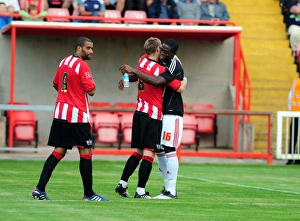 Bristol Citys John Akinde with former team mate David Noble Bristol Citys John Akinde with former team mate David Noble