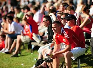 Images Dated 15th July 2010: Fans from both teams sit in the sun to watch the game