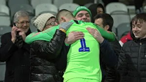<b class=qtipBold><figcaption>Family Embrace For Jimmy Corcoran</figcaption></b><br>PNE youth goalkeeper Jimmy Corcoran is embraced by his family after he saved two penalties in their penalty shootout against Charlton Athletic U18s in the FA Youth Cup third round at Deepdale.<br><em>© DAVE KENDALL/Preston North End Football Club</em> Family Embrace For Jimmy Corcoran