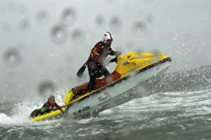 Two beach lifeguards on a rescue water craft