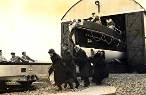 Black and white photo of the lady launchers hauling the Dungeness lifeboat Black and white photo of the lady launchers hauling the Dungeness lifeboat