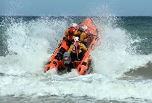 Images Dated 16th June 2011: Cromer D-class inhsore lifeboat George and Muriel D-734 heading through a breaking wave following