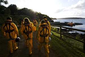 Group shot of the Tenby crew members walking along towards the Tamar class lifeboat Haydn Group shot of the Tenby crew members walking along towards the Tamar class lifeboat Haydn