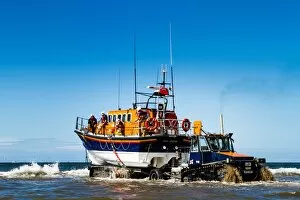 Images Dated 27th August 2013: Rhyl Mersey class lifeboat Lil Cunningham 12-24 being launched by tractor