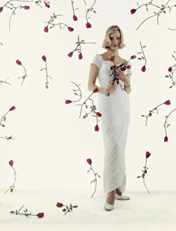 <b class=qtipBold><figcaption>Advertisement for Crane boilers</figcaption></b><br>Advertisement for Crane boilers -- female model (M Colbrook) with red roses. 1959<br><em>© The Colin Sherborne Collection/Mary Evans Picture Library</em> Advertisement for Crane boilers