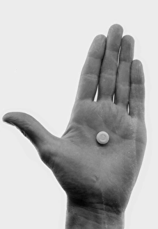<b class=qtipBold><figcaption>Advertisement for Daxaids</figcaption></b><br>Advertisement for Daxaids -- a hand with a white pill. 1959<br><em>© The Colin Sherborne Collection/Mary Evans Picture Library</em> Advertisement for Daxaids
