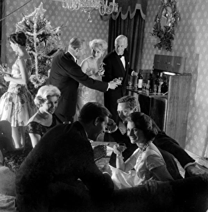 <b class=qtipBold><figcaption>Advertisement for Emu sherry</figcaption></b><br>Advertisement for Emu sherry -- male and female models posing in Christmas party scene. 1959<br><em>© The Colin Sherborne Collection/Mary Evans Picture Library</em> Advertisement for Emu sherry