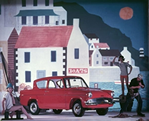 <b class=qtipBold><figcaption>Advertisement for Ford Anglia cars</figcaption></b><br>Advertisement for Ford Anglia cars -- male and female models posing (Geraldine Hill, Susan Ingram and Ossie O'Leary). 1959<br><em>© The Colin Sherborne Collection/Mary Evans Picture Library</em> Advertisement for Ford Anglia cars
