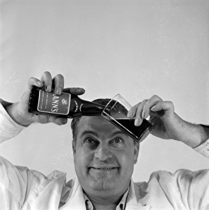 <b class=qtipBold><figcaption>Advertisement for Manns brown ale</figcaption></b><br>Advertisement for Manns brown ale -- male model pouring beer from a bottle into a glass. 1959<br><em>© The Colin Sherborne Collection/Mary Evans Picture Library</em> Advertisement for Manns brown ale