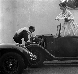 <b class=qtipBold><figcaption>Advertisement for Manns brown ale</figcaption></b><br>Advertisement for Manns brown ale -- male and female models posing with a car that won't start. 1959<br><em>© The Colin Sherborne Collection/Mary Evans Picture Library</em> Advertisement for Manns brown ale