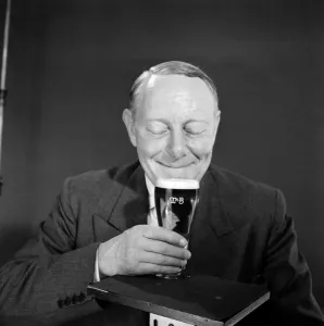<b class=qtipBold><figcaption>Advertisement for M&B Export Beer</figcaption></b><br>Advertisement for M&B Export Beer -- male model (Derek Prentice) holding a full pint glass. 1959<br><em>© The Colin Sherborne Collection/Mary Evans Picture Library</em> Advertisement for M&B Export Beer