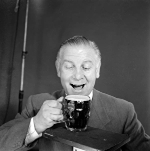 <b class=qtipBold><figcaption>Advertisement for M&B Mild Beer</figcaption></b><br>Advertisement for M&B Mild Beer -- male model (Vincent Charles) posing with a pint glass. 1959<br><em>© The Colin Sherborne Collection/Mary Evans Picture Library</em> Advertisement for M&B Mild Beer