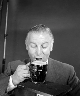 <b class=qtipBold><figcaption>Advertisement for M&B Mild Beer</figcaption></b><br>Advertisement for M&B Mild Beer -- male model (Vincent Charles) posing with a pint glass. 1959<br><em>© The Colin Sherborne Collection/Mary Evans Picture Library</em> Advertisement for M&B Mild Beer