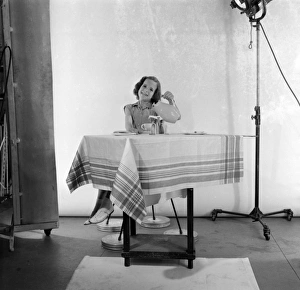 <b class=qtipBold><figcaption>Advertisement for Nescafe</figcaption></b><br>Advertisement for Nescafe -- little girl (Caroline Ellis) sitting at a table. 1959<br><em>© The Colin Sherborne Collection/Mary Evans Picture Library</em> Advertisement for Nescafe