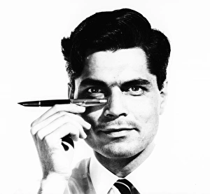 <b class=qtipBold><figcaption>Advertisement for Parker Pens</figcaption></b><br>Advertisement for Parker Pens -- male model (S Purvis) holding up a fountain pen. 1959<br><em>© The Colin Sherborne Collection/Mary Evans Picture Library</em> Advertisement for Parker Pens