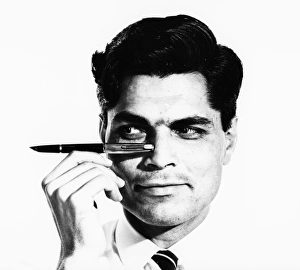 <b class=qtipBold><figcaption>Advertisement for Parker Pens</figcaption></b><br>Advertisement for Parker Pens -- male model (S Purvis) holding up a fountain pen. 1959<br><em>© The Colin Sherborne Collection/Mary Evans Picture Library</em> Advertisement for Parker Pens