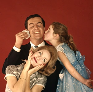 <b class=qtipBold><figcaption>Advertisement for Remington shavers</figcaption></b><br>Advertisement for Remington shavers -- three models posing as a happy family (J Fenton, Sarah Branch and Jane Hancock). 1959<br><em>© The Colin Sherborne Collection/Mary Evans Picture Library</em> Advertisement for Remington shavers