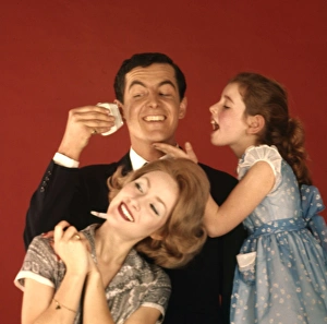 <b class=qtipBold><figcaption>Advertisement for Remington shavers</figcaption></b><br>Advertisement for Remington shavers -- three models posing as a happy family (J Fenton, Sarah Branch and Jane Hancock). 1959<br><em>© The Colin Sherborne Collection/Mary Evans Picture Library</em> Advertisement for Remington shavers