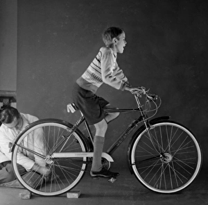 <b class=qtipBold><figcaption>Advertisement for Triumph bicycles</figcaption></b><br>Advertisement for Triumph bicycles -- boy model (David Scully). 1959<br><em>© The Colin Sherborne Collection/Mary Evans Picture Library</em> Advertisement for Triumph bicycles