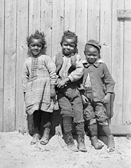 Three African American children smiling together in America Three African American children smiling together in America