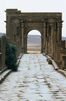 Algeria. Timgad. Roman causeway and Trajans Arch Algeria. Timgad. Roman causeway and Trajans Arch
