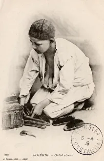 <b class=qtipBold><figcaption>Algeria - A Young Ouled Bootblack</figcaption></b><br>Algeria - A Young Ouled Bootblack. Date: circa 1907<br><em>© Mary Evans / Grenville Collins Postcard Collection</em> Algeria - A Young Ouled Bootblack