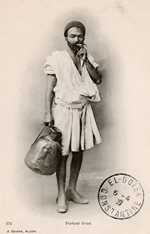 <b class=qtipBold><figcaption>Algerian Water Carrier</figcaption></b><br>Algerian Water Carrier. Date: circa 1907<br><em>© Mary Evans / Grenville Collins Postcard Collection</em> Algerian Water Carrier