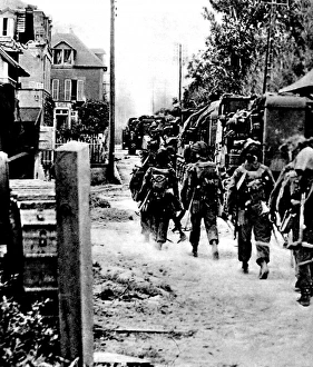 Allied Troops moving through a French village; Second World Allied Troops moving through a French village; Second World