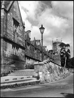 <b class=qtipBold><figcaption>Almshouses, Glos</figcaption></b><br>The fine 17th century Almshouses and beautiful church tower at Chipping Camden, Gloucestershire, a delightful old-world town in the Cotswolds.<br><em>© Mary Evans Picture Library</em> Almshouses, Glos