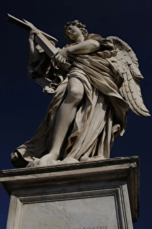 Angel with a cross by Ercole Ferrata (1610-1686). Sant'Angel Angel with a cross by Ercole Ferrata (1610-1686). Sant'Angel