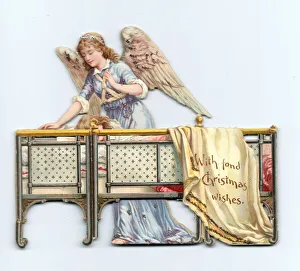 Angel and sleeping girl on a cutout Christmas card Angel and sleeping girl on a cutout Christmas card