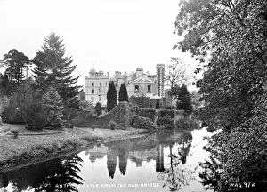 Prints of Antrim Castle from the Old Bridge - a scenic view looking down the river to the castle. (Location: Northern Ireland: County Antrim: Antrim). Date: circa early 1900s Antrim Prints: Antrim Castle Print: Early 1900s Scenic View