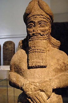 Assyrian figure of an attendant god. Nimrud Assyrian figure of an attendant god. Nimrud