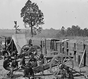 Atlanta, Ga. Federal soldiers relaxing by guns of captured f Atlanta, Ga. Federal soldiers relaxing by guns of captured f