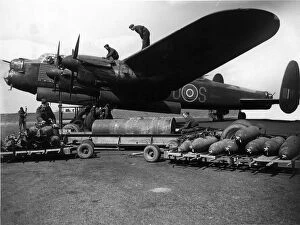 Avro Lancaster I R5868 S for Sugar being bombed up