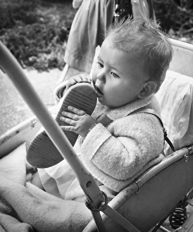 Baby holding shoe in Balham, SW London Baby holding shoe in Balham, SW London
