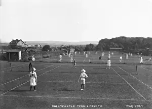 Prints of Ballycastle Tennis Courts - a view of a lot of people playing tennis. (Location: Northern Ireland; County Antrim; Ballycastle). Date: circa early 1900s Sport Prints: Early 20th Century Ballycastle Tennis Courts Print