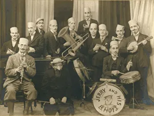 Bands Gallery: A band, most of whom are wearing disguise of heavy eyebrows and moustaches