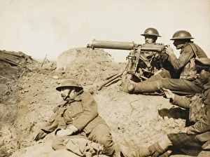 <b class=qtipBold><figcaption>Battle of Menin Road</figcaption></b><br>Soldiers with a machine gun at the Battle of Menin Road during World War I. Note the soldier admiring himself in a German officer's cap.<br><em>© Robert Hunt Library/Mary Evans</em> Battle of Menin Road