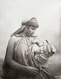 Related Images Collection: Bedouin woman breast-feeding baby, Tunisia, c, 1890