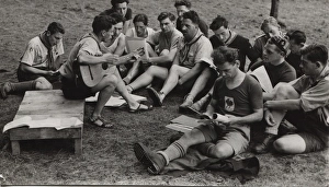 Belgian or French boy scouts singing at camp