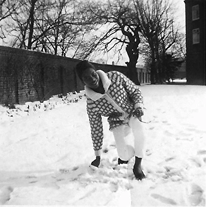 Jeans Gallery: Black teenage girl touching and kneeling in the snow in Nott