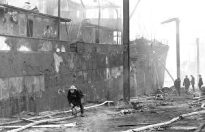 Blitz in London, ship at Surrey Commercial Docks, WW2 Blitz in London, ship at Surrey Commercial Docks, WW2