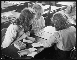 <b class=qtipBold><figcaption>Board Games 1950S</figcaption></b><br>A group of young schoolgirls playing a board game<br><em>© Mary Evans Picture Library/HENRY GRANT</em> Board Games 1950S