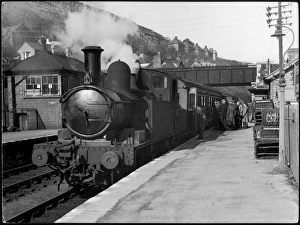 <b class=qtipBold><figcaption>Boarding a Steam Train</figcaption></b><br>People board a steam train waiting in the station<br><em>© Mary Evans Picture Library</em> Boarding a Steam Train