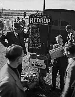 Bookmaker and punters at racecourse