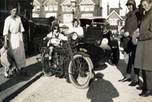 Boy sitting on a 1918 Harley Davidson motorcycle Boy sitting on a 1918 Harley Davidson motorcycle