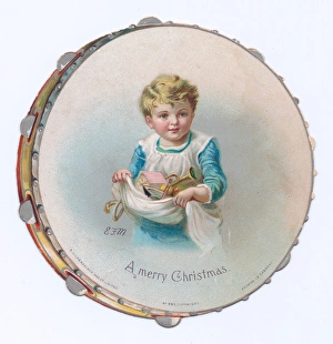 Boy on a tambourine-shaped Christmas card Boy on a tambourine-shaped Christmas card