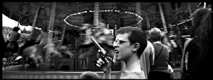 Boy with toy gun at a fairground, London, England Boy with toy gun at a fairground, London, England